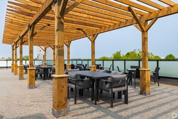 Wooden pergola with table and chairs